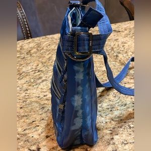 Lug crossbody breezer bag by Lug. Perfect size, not too bulky big, holds plenty.